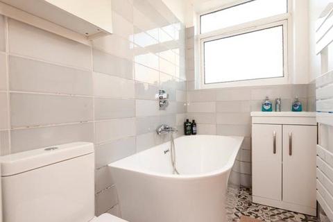 4 Abbey Road, London, SW19 2LZ