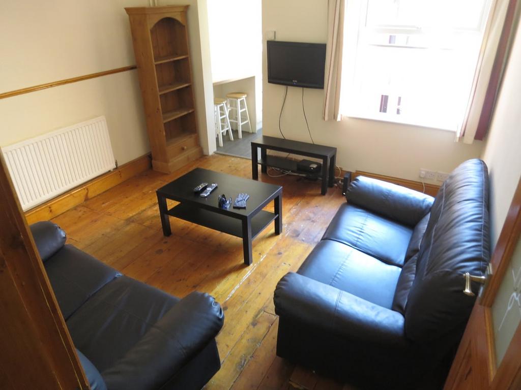 Bright, neatly presented living room with wood ...