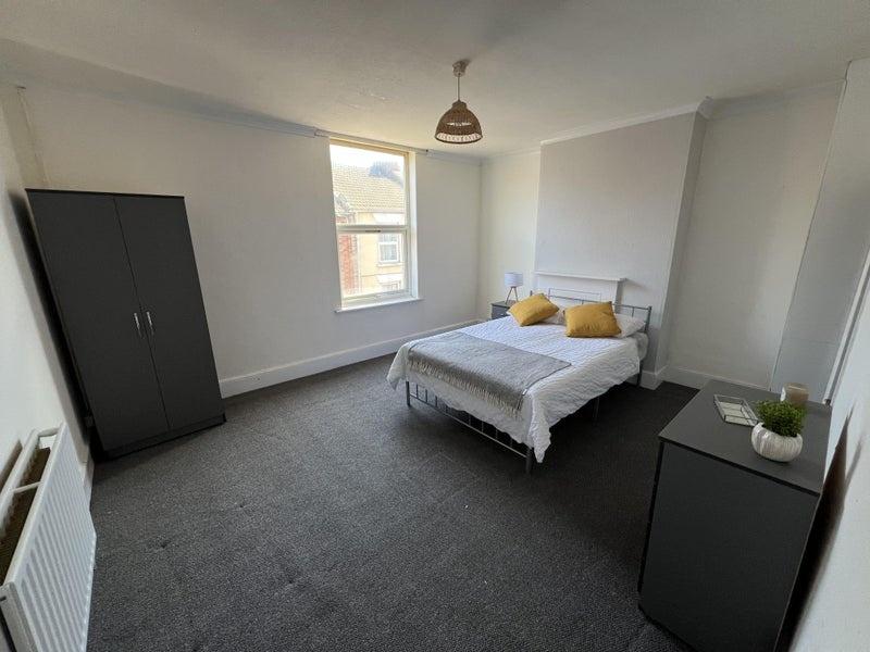 Bright and airy double bedroom featuring a comf...