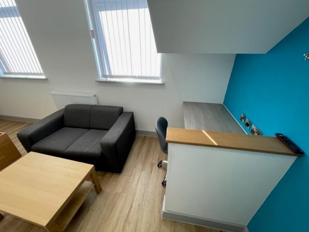 A modern and bright communal lounge area featur...