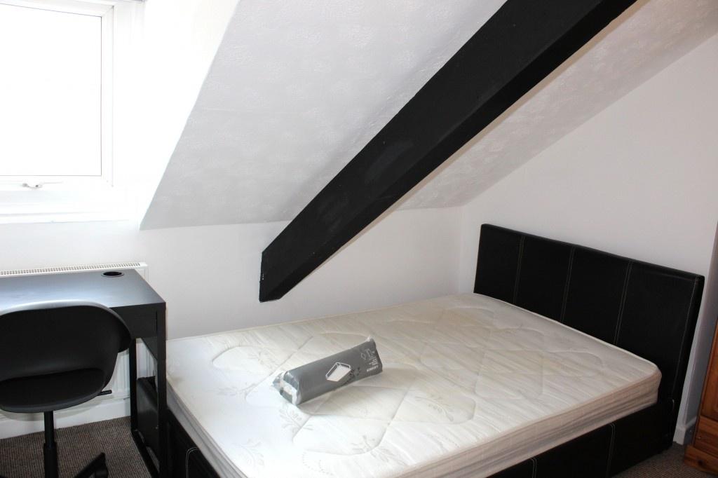 A bright and cozy double bedroom featuring a co...