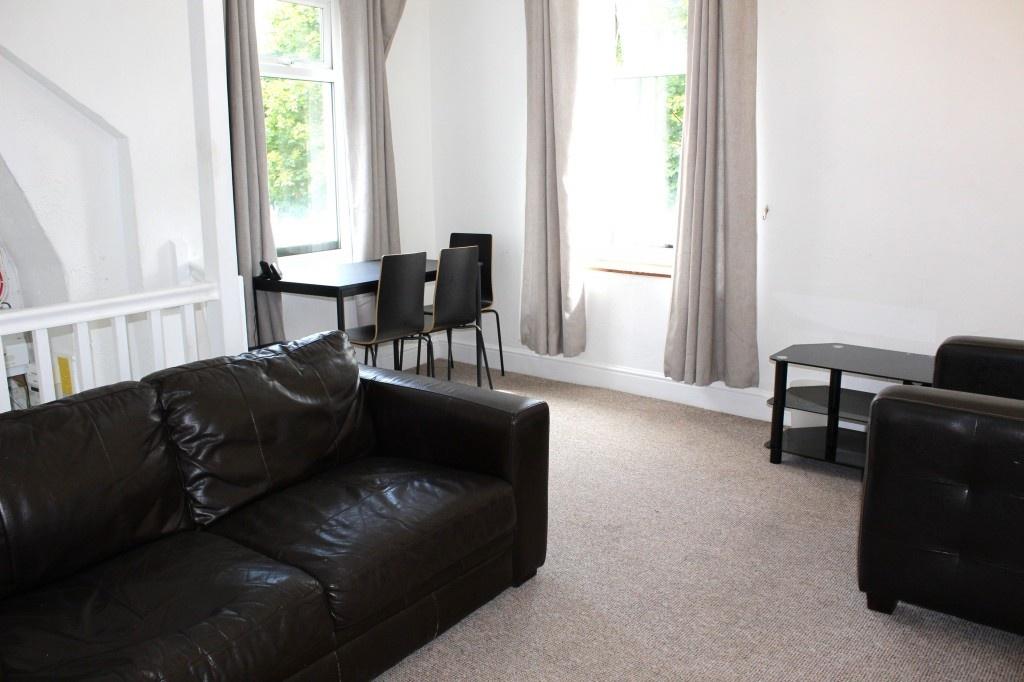Bright and welcoming living room featuring comf...