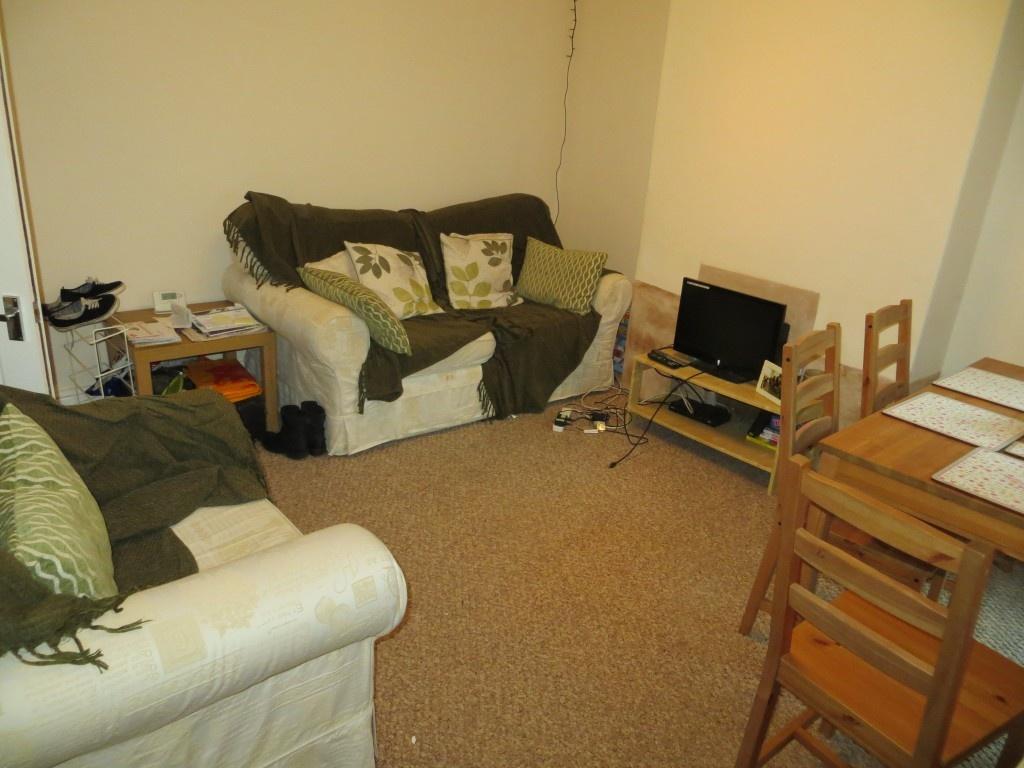 A cozy living room featuring comfortable sofas ...