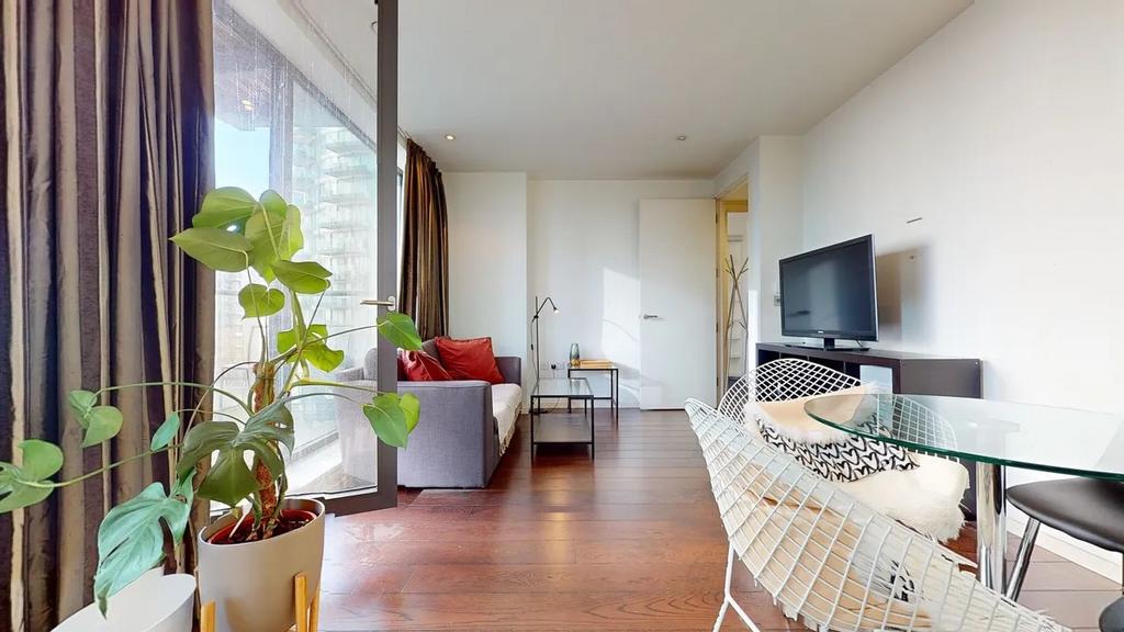 A modern and inviting living room featuring war...