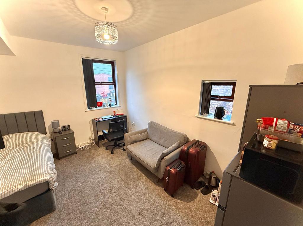 Cozy and well-maintained bedroom featuring a co...