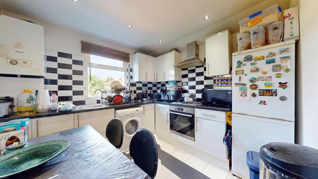 Bright and modern kitchen featuring a stylish b...