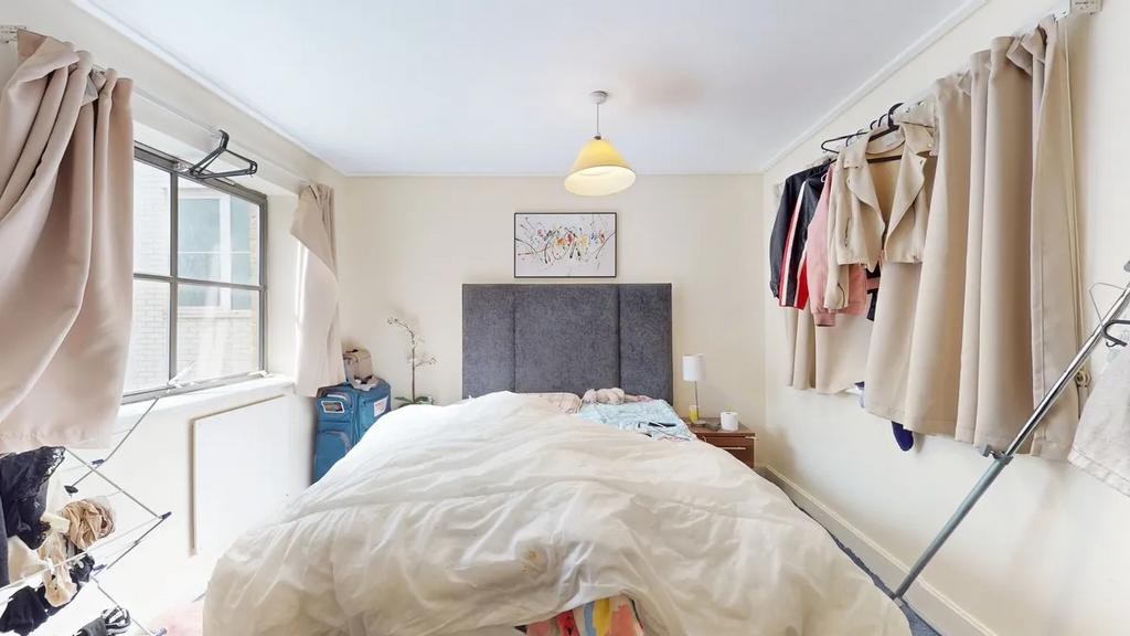 Bright and cozy double bedroom featuring a comf...