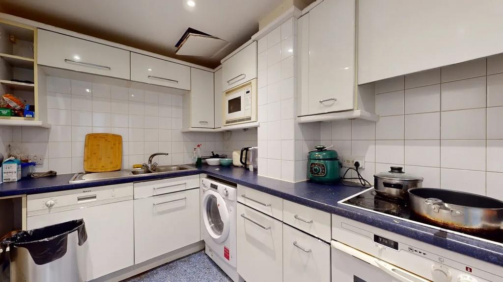 Bright and functional kitchen featuring ample w...