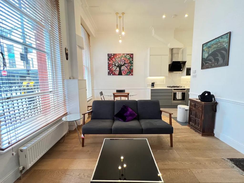A stylish and modern living room featuring a sl...