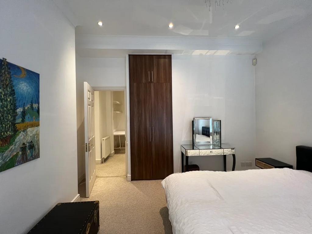 Bright and tidy double bedroom featuring a comf...