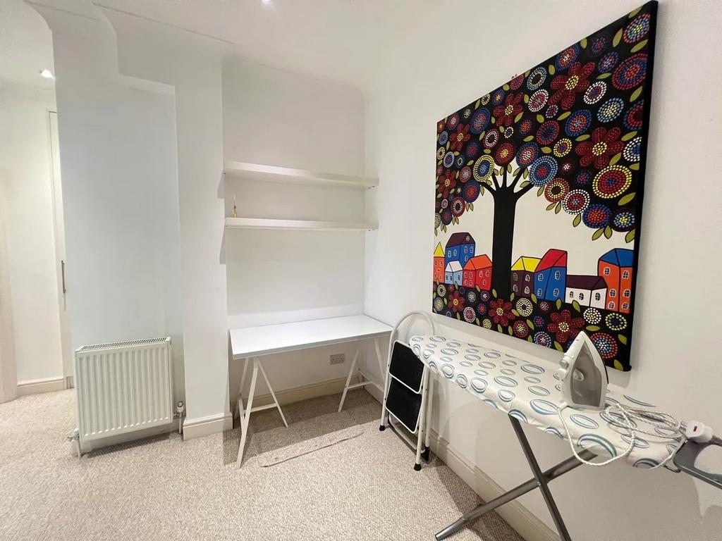 Bright and tidy hallway area featuring clean wh...