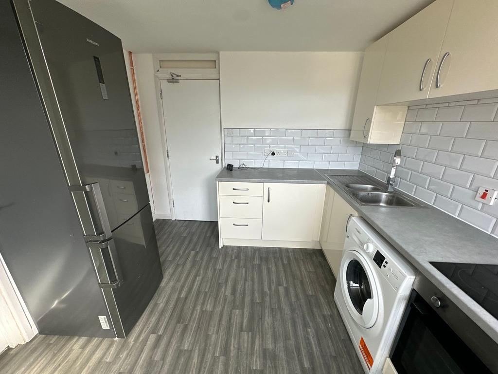 A modern and clean kitchen featuring ample coun...
