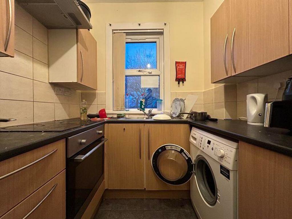 A cozy kitchenette with essential appliances, p...