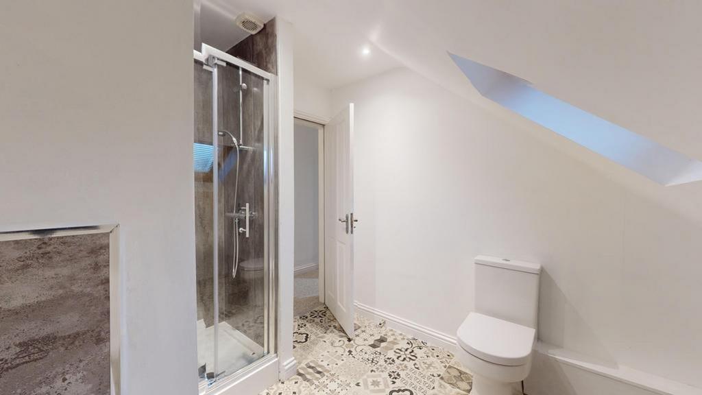 A modern and clean bathroom featuring a spaciou...