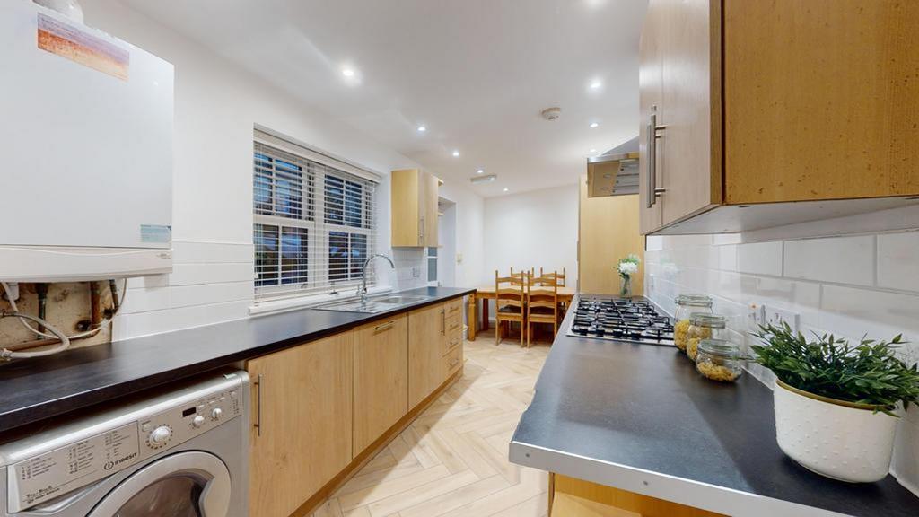 A modern and tidy kitchen with ample storage an...