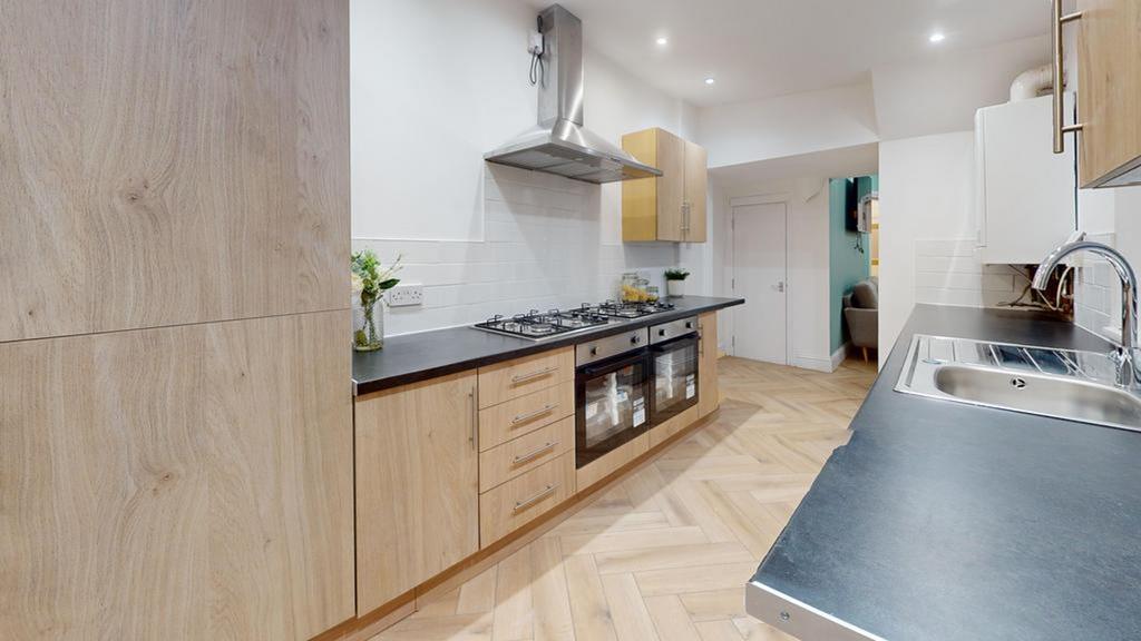 A modern and spacious kitchen with ample storag...