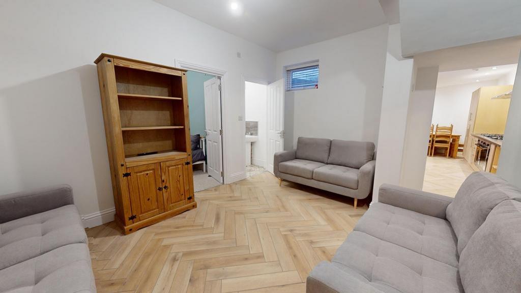 A spacious and inviting living room with modern...