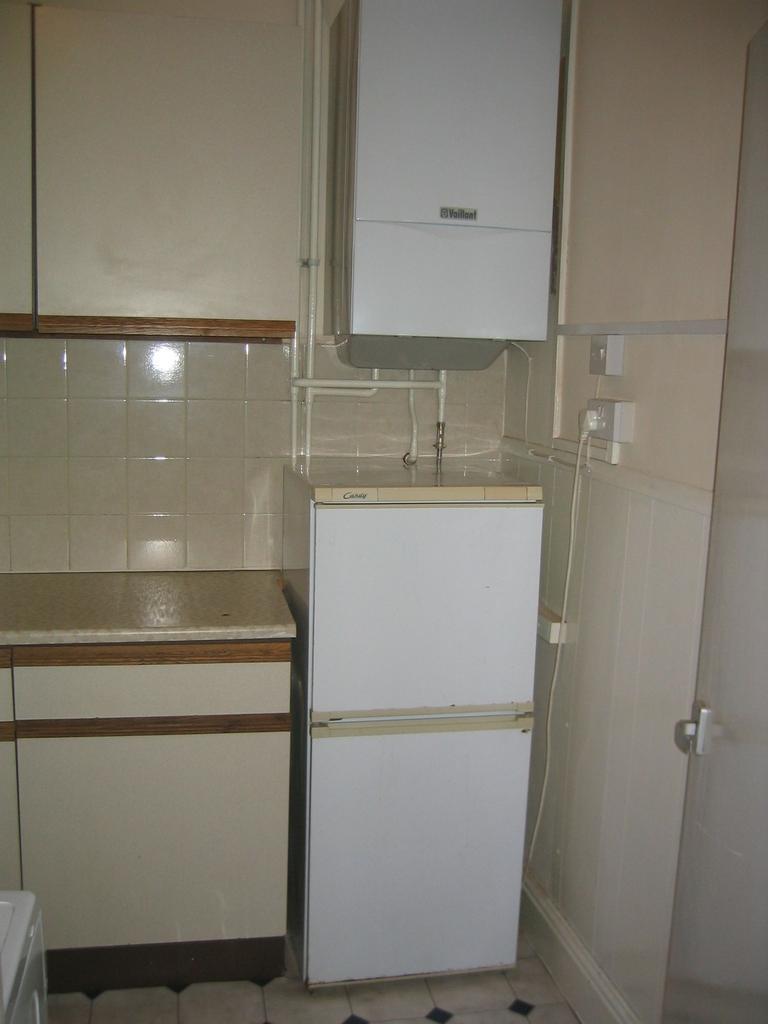 Compact kitchen space featuring practical cabin...