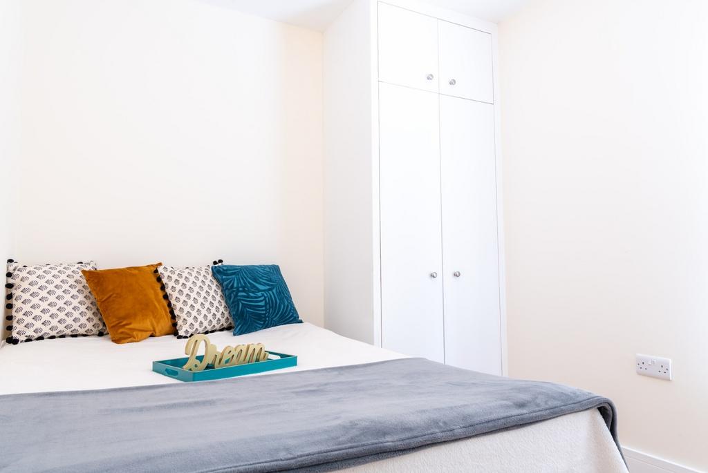 Cozy double bedroom featuring a comfortable bed...