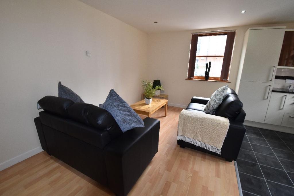A cozy and well-maintained living room featurin...