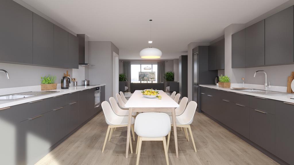 A spacious and modern kitchen with ample dining...