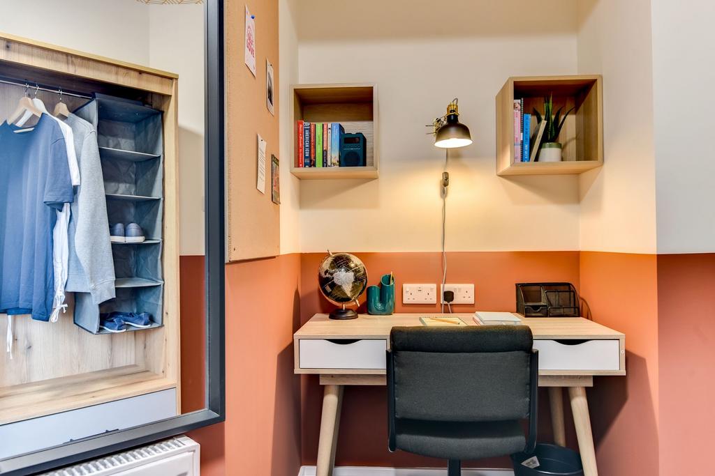 A cozy study nook featuring a stylish desk with...