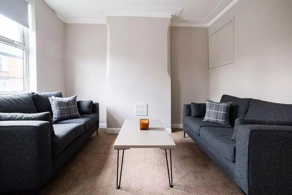 A cozy living room featuring two matching dark ...