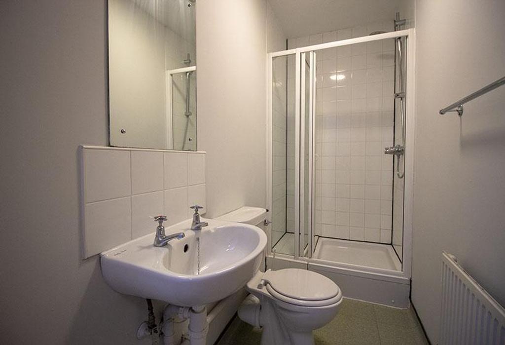 A modern bathroom featuring a clean design with...