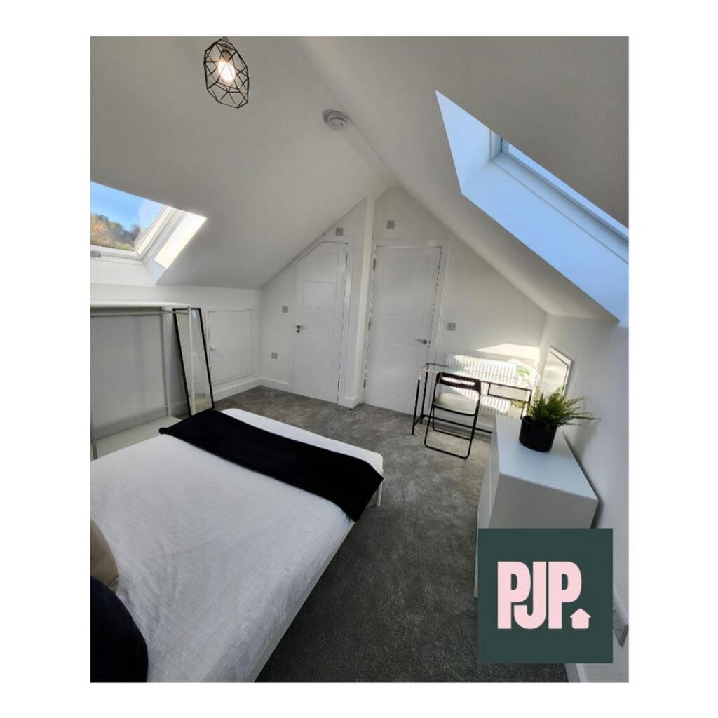 A beautifully designed double bedroom featuring...