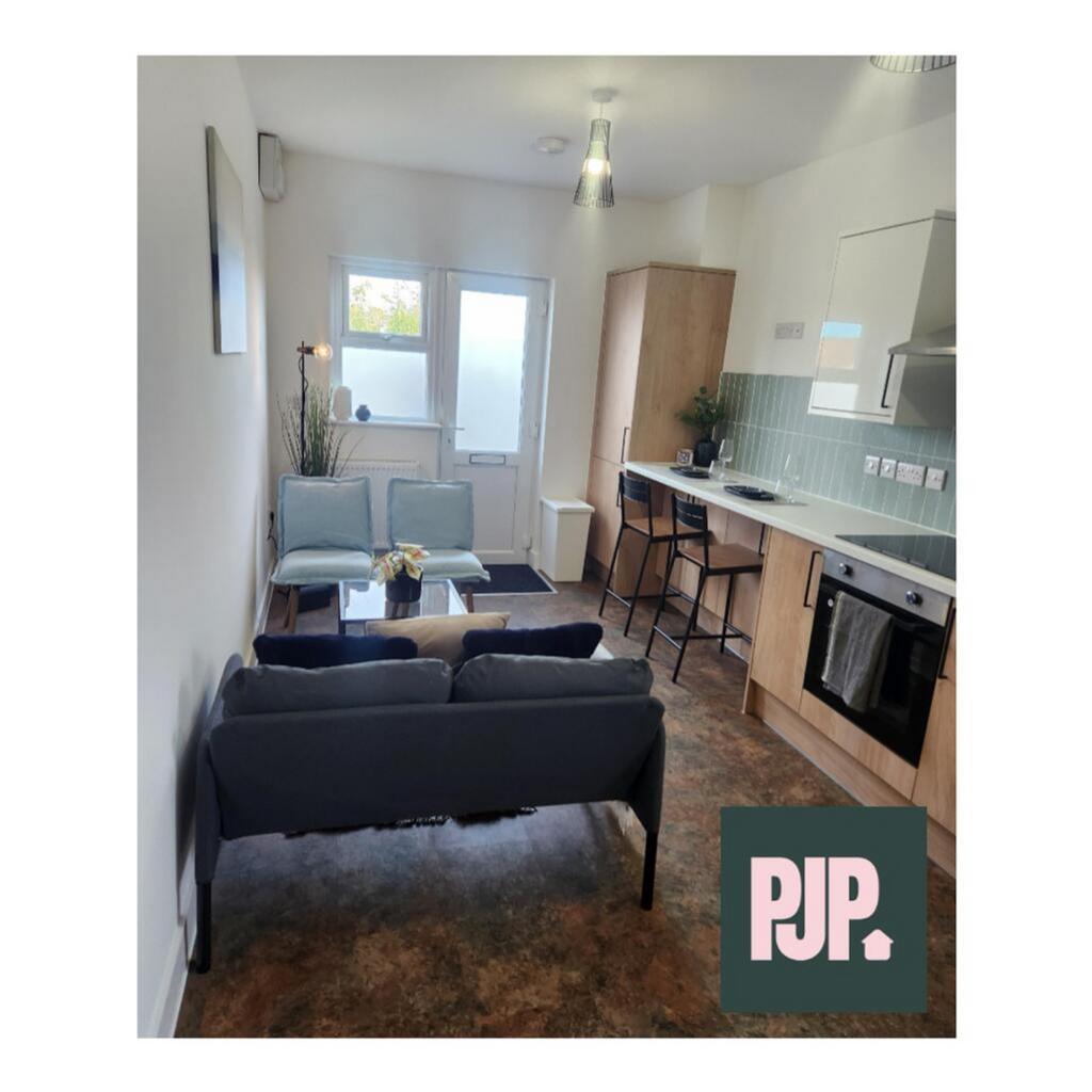 Modern kitchen with an open layout, featuring s...