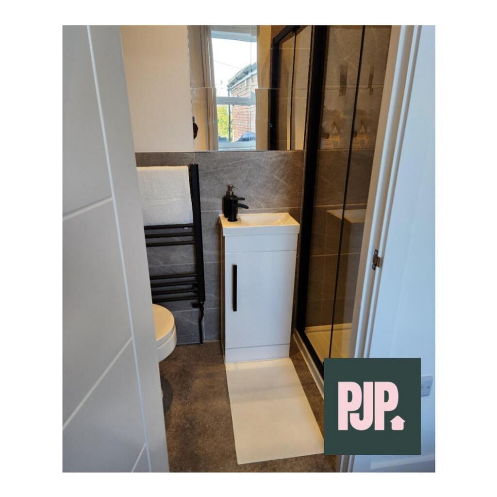 Modern bathroom featuring a sleek design with a...