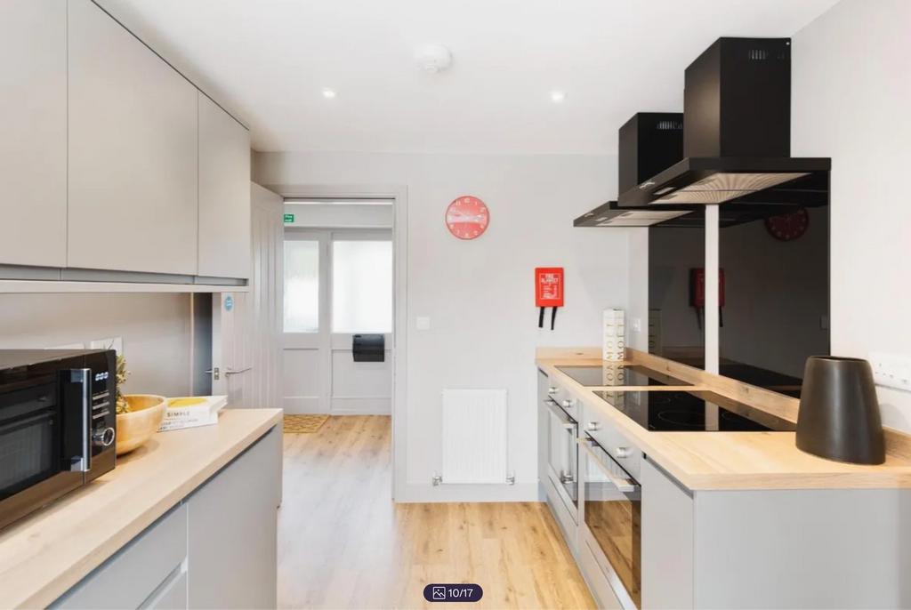 A modern and clean kitchenette featuring sleek ...