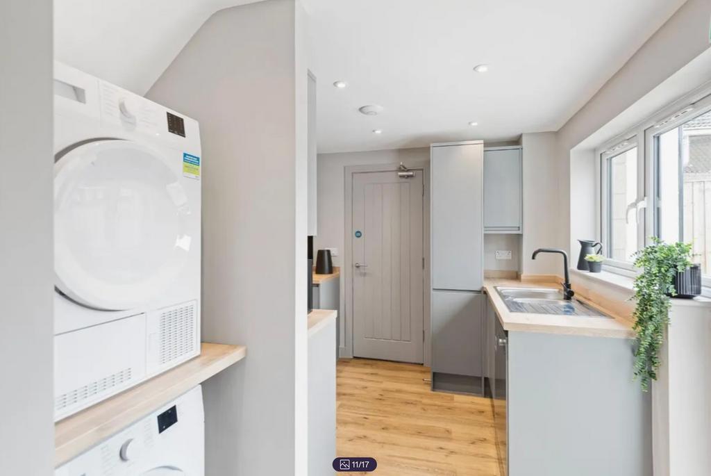 A modern and well-equipped kitchenette with amp...