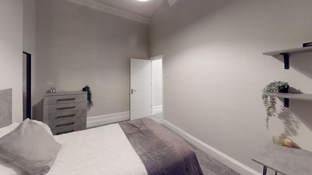 A bright and inviting double bedroom, perfect f...