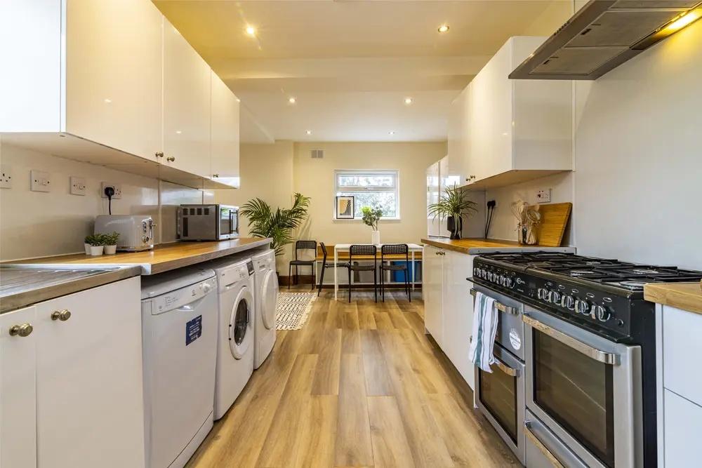 Bright and modern kitchen featuring ample count...