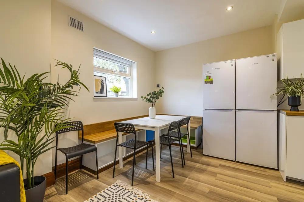 Bright and modern kitchen featuring ample natur...