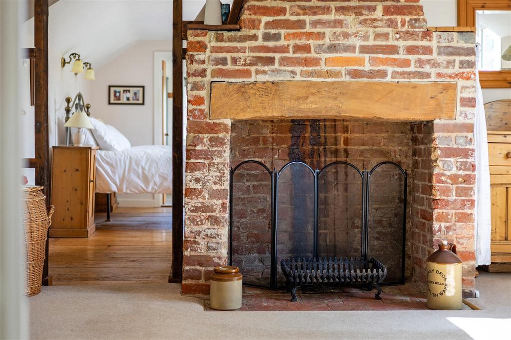 Fireplace in Bed 4 through to Principal Bedroom