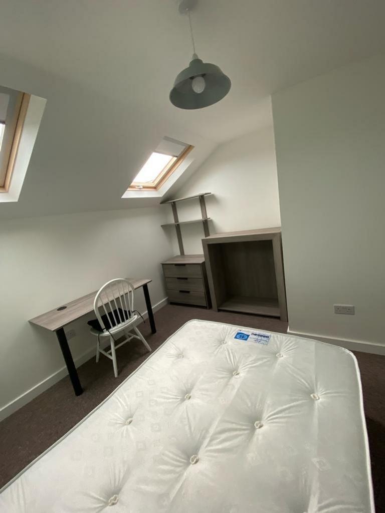 A bright and inviting double bedroom featuring ...