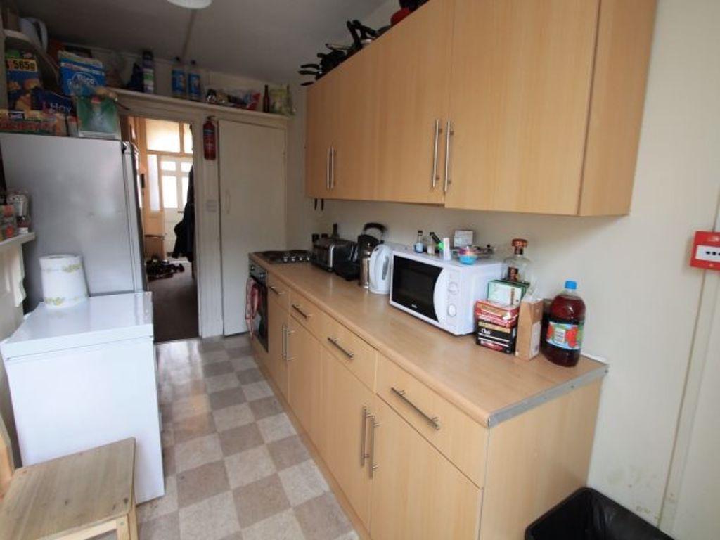 A tidy, well-organized kitchen featuring light ...