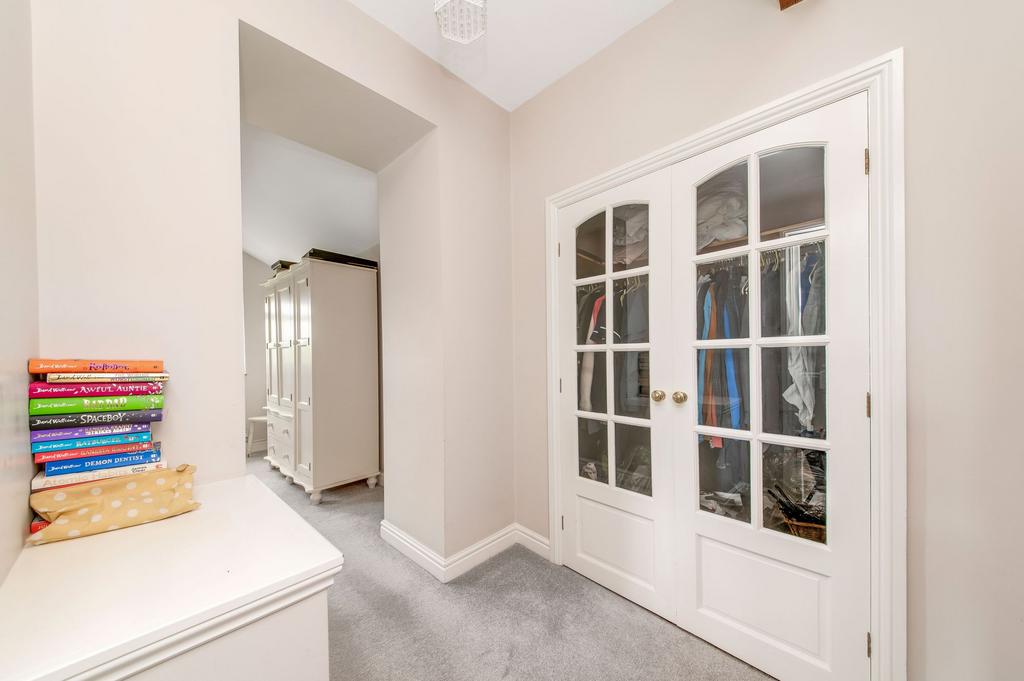 Bedroom one walk in wardrobe / dressing area