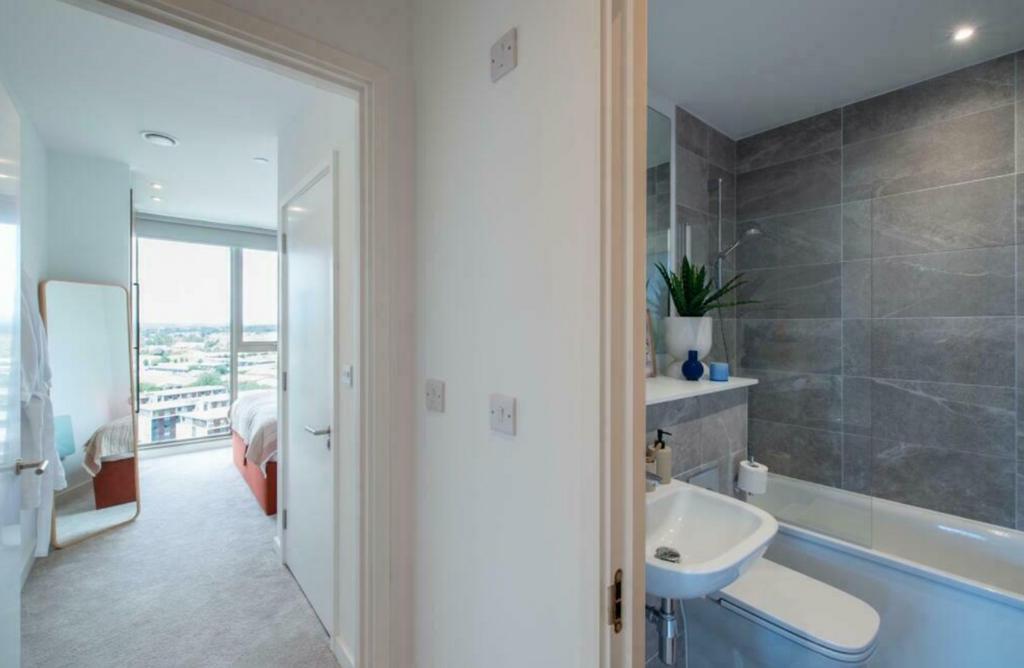 A bright and modern bathroom featuring a stylis...