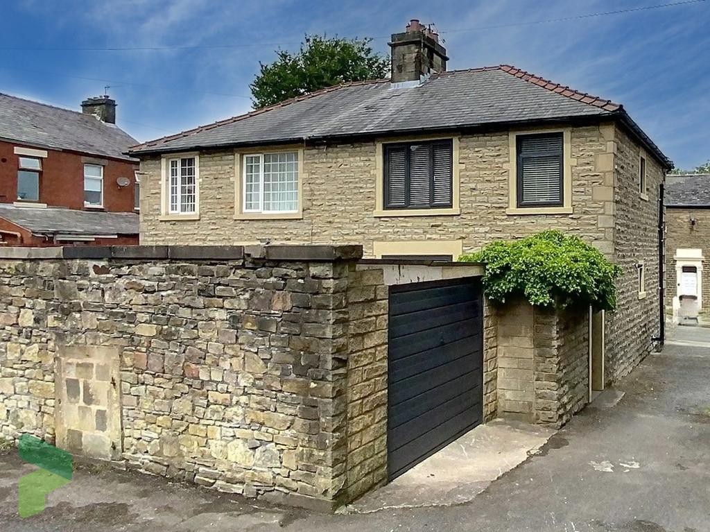 Rear Exterior and Garage Entrance