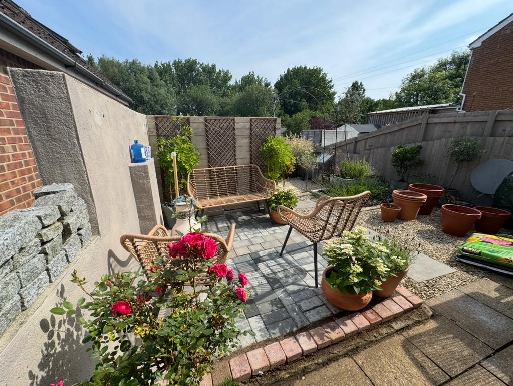 A charming and well-maintained garden featuring...