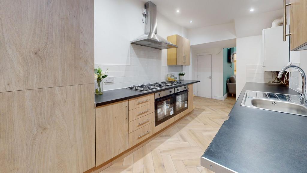 A modern and spacious kitchen featuring stylish...