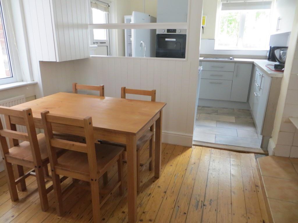 Bright and functional kitchen area with natural...