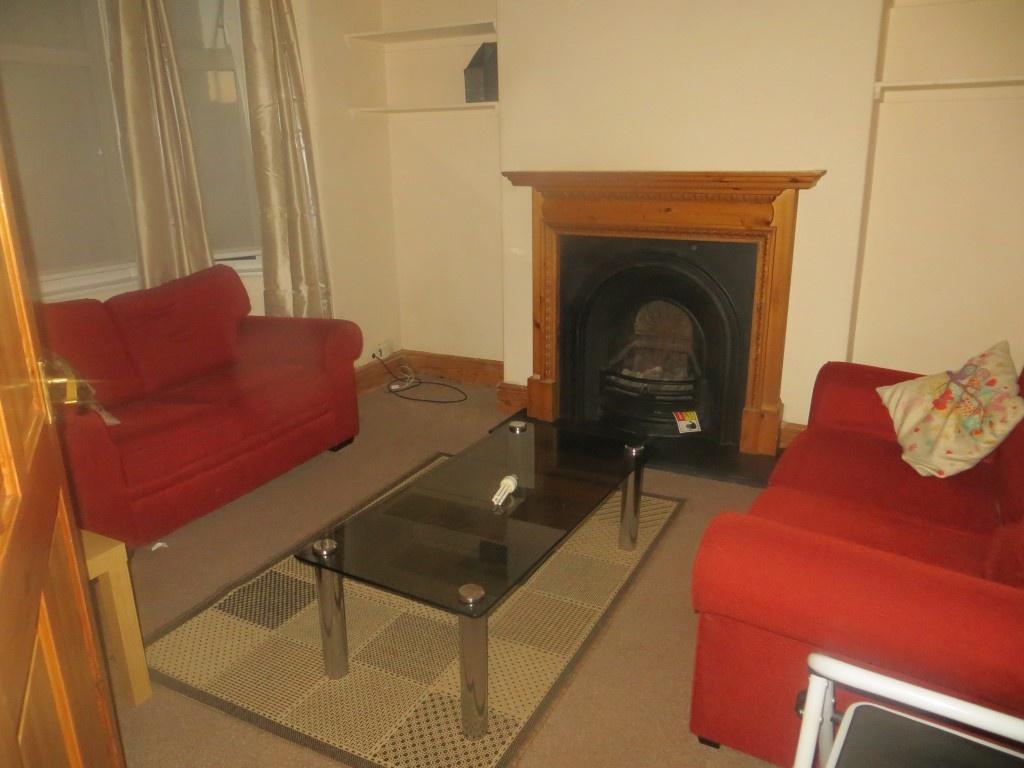 Cozy living room featuring two comfortable red ...
