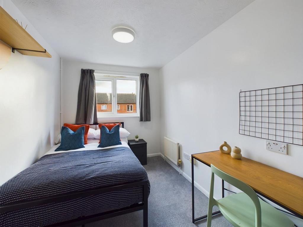A stylish and inviting double bedroom featuring...