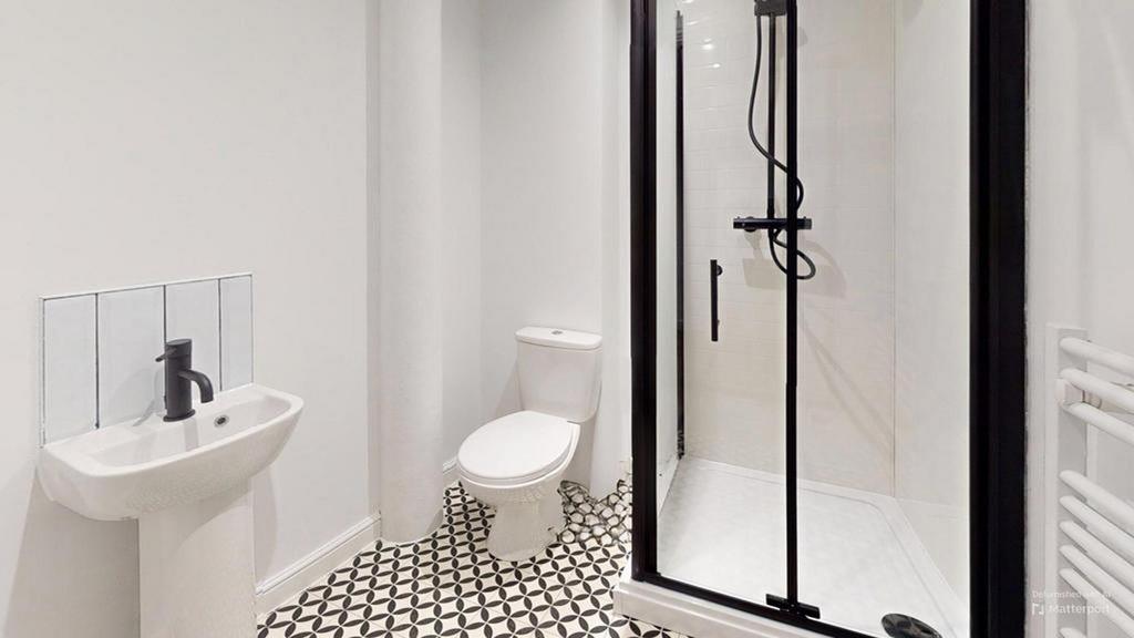 A modern and stylish bathroom featuring a sleek...