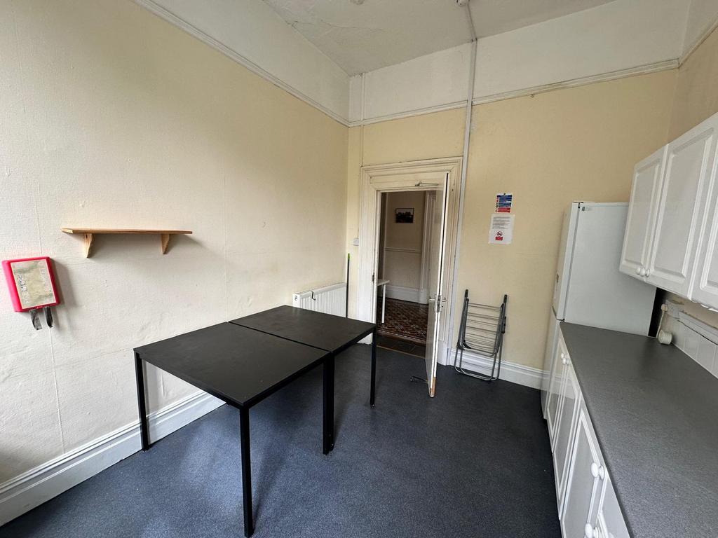 A functional kitchenette with ample space for c...