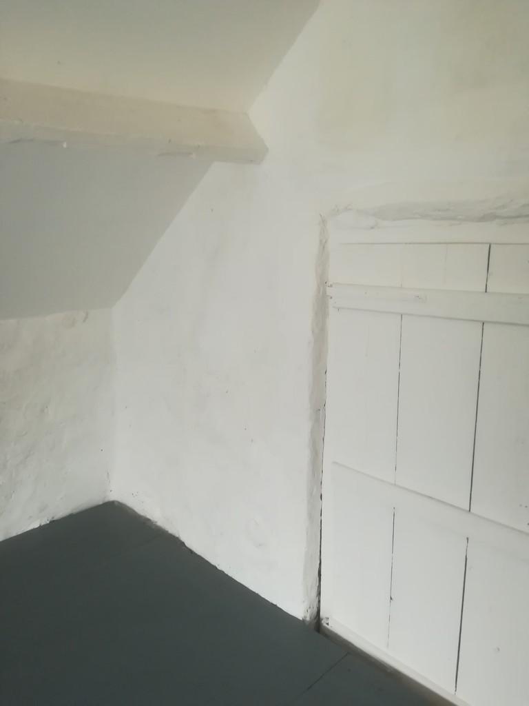 Stable loft showing former doorway to house